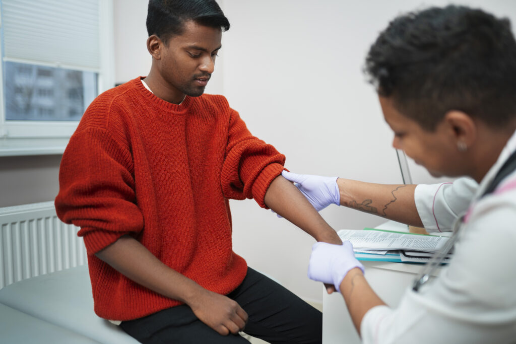 nurse dressing surgical wound at home